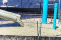 Pouring concrete slap of the bath room with the water and drain pvc pipes installed Royalty Free Stock Photo