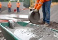 pouring concrete with worker mix cement at construction Royalty Free Stock Photo