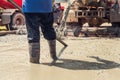 pouring concrete with worker mix cement at construction Royalty Free Stock Photo