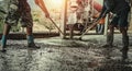 pouring concrete with worker mix cement at construction site Royalty Free Stock Photo