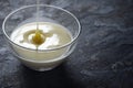 Pouring condensed milk in the glass bowl horizontal Royalty Free Stock Photo