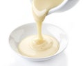 Pouring condensed milk Royalty Free Stock Photo