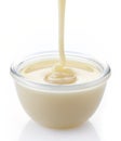 Pouring condensed milk Royalty Free Stock Photo