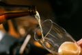 Pouring craft beer from the bottle in to the glass