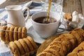 Pouring into the cup tea, sugar and cookies. Royalty Free Stock Photo