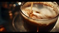 pouring delicious coffee in cup of coffee with rising steam