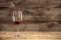 Pouring delicious red wine into glass Royalty Free Stock Photo