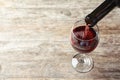 Pouring delicious red wine into glass Royalty Free Stock Photo