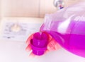 Pouring detergent for washing machine Royalty Free Stock Photo