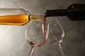 Pouring different wines from bottles into glasses Royalty Free Stock Photo