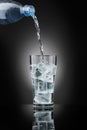 Drinking water,on dark background Royalty Free Stock Photo
