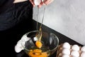 Pouring eggs into a glass cup Royalty Free Stock Photo