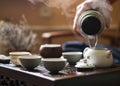 Pouring of Exquisite Hot Tea in Teapot at Traditional Chinese Tea Ceremony. Set of Equipment