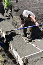 Pouring fresh concrete in a construction foundation project Royalty Free Stock Photo