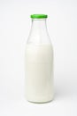 Pouring fresh glass of milk isolated Royalty Free Stock Photo