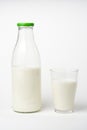 Pouring fresh glass of milk isolated