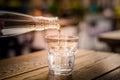 Pouring fresh mineral water into glass Royalty Free Stock Photo