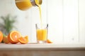 pouring fresh vitamin juice into glass off orange Royalty Free Stock Photo