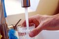 Pouring water into a glas. Royalty Free Stock Photo