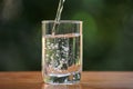 Pouring fresh water into a glass Royalty Free Stock Photo