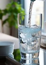 Pouring fresh water into glass from tap Royalty Free Stock Photo