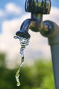 Pouring fresh water  from the metal tap Royalty Free Stock Photo