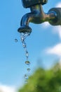 Pouring fresh water  from the metal tap Royalty Free Stock Photo