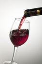 Pouring a glass of red wine Royalty Free Stock Photo