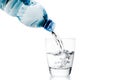 Pouring a glass with water trough little blue bottle Royalty Free Stock Photo