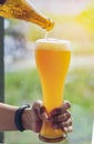 Pouring Golden Beer in a Glass for Oktoberfest. Pint of Draft Wheat Beers in Friendship Bachelorette Parties at Bar. Young people Royalty Free Stock Photo