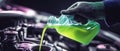 Pouring Green Coolant into Car Engine System Royalty Free Stock Photo