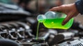 Pouring Green Coolant into Car Engine System Royalty Free Stock Photo