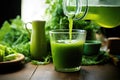pouring green juice into a glass jug