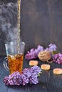 Pouring Healthy Tea with candles on a bakcground