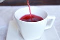 Pouring hibiscus tea