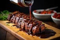 pouring homemade barbecue sauce over seitan steaks