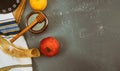 Pouring honey on apple and pomegranate with honey symbols of Jewish New Year - Rosh Hashanah Royalty Free Stock Photo