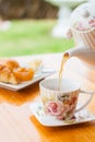 Pouring hot tea Royalty Free Stock Photo