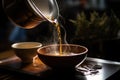 pouring hot water over tea leaves in a gaiwan