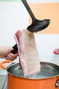 Pouring hot water on raw pork belly skin Royalty Free Stock Photo