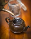 Pouring hot water into a tea kettle Royalty Free Stock Photo