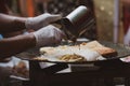 Pouring ingredients of indonesian martabak