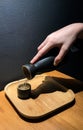 Pouring japanese sake from jug into a black ceramic cup Royalty Free Stock Photo