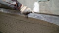 Pouring, laying concrete at the construction site using buckets of cement. Building, concrete work on the roof. Alignment of the Royalty Free Stock Photo