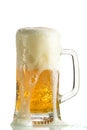 Pouring light beer in a beer mug, it turns out foam and spray Royalty Free Stock Photo