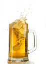 Pouring light beer in a beer mug, it turns out foam and spray Royalty Free Stock Photo