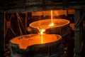 Pouring liquid metal from arc furnace Royalty Free Stock Photo