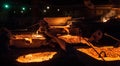 Pouring liquid titanium slag from arc furnace