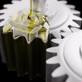 Pouring Lube on Gearwheels 3d Illustration