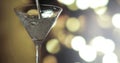 Pouring Martini into a glass. Blurred background Royalty Free Stock Photo